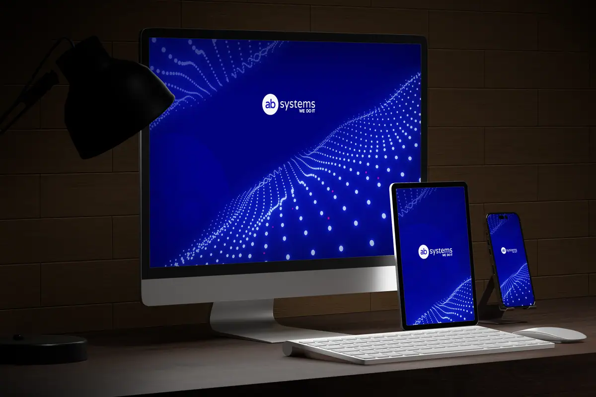 AB Systems: tło z falą świecących punktów i logo na ekranach komputera, tabletu i telefonu