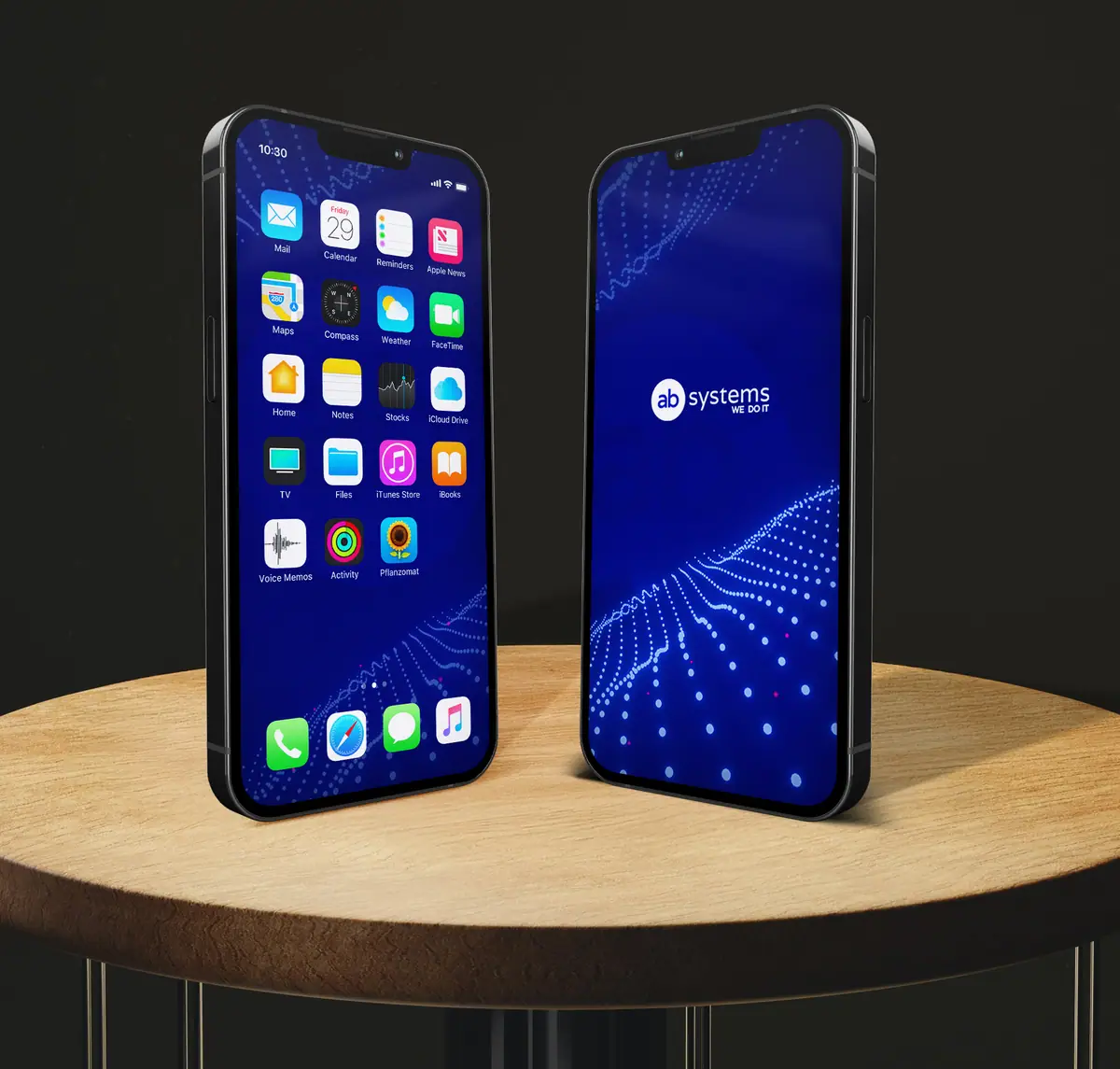 AB Systems: dwa telefony na drewnianym stoliku, tapeta z falą punktów i logo