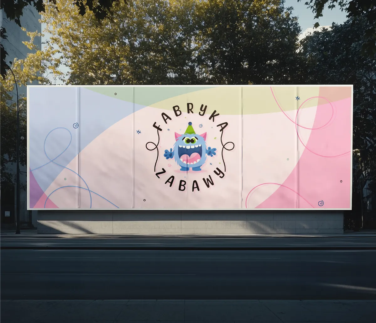 Fabryka Zabawy: billboard among trees with the logo on a pastel background with pink and light blue waves