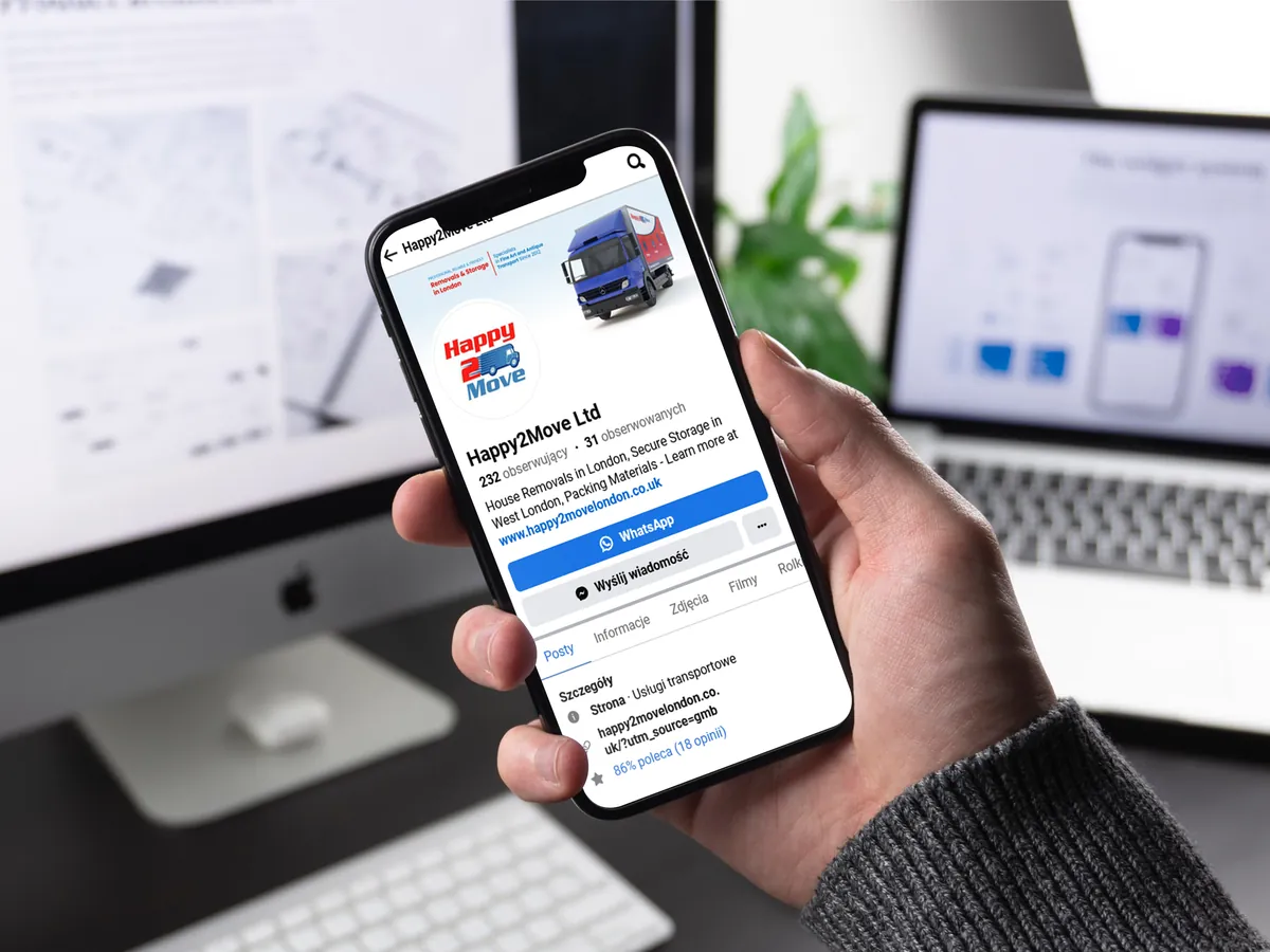 Happy2Move: Happy2Move Ltd Facebook profile with a cover photo and a WhatsApp button on a phone held in a hand
