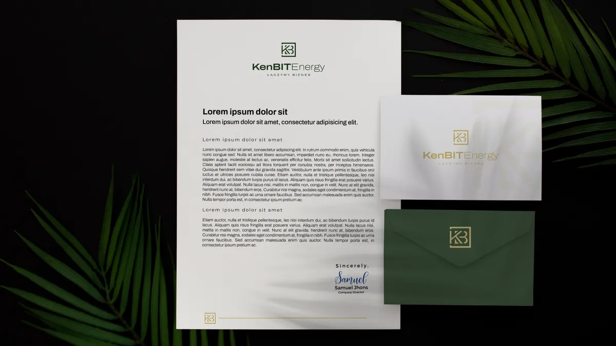 KenBIT Energy: letterhead, white and green envelopes with a gold logo on a black background with palm leaves