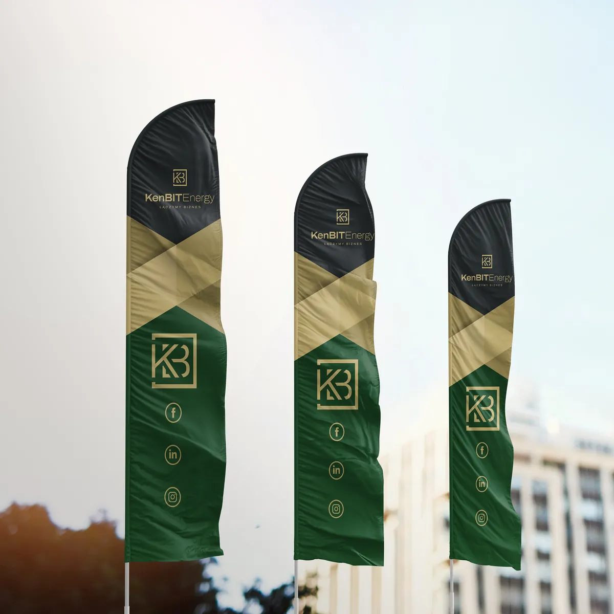KenBIT Energy: three advertising flags with the logo and brandmark in front of a building, graphite, gold and green