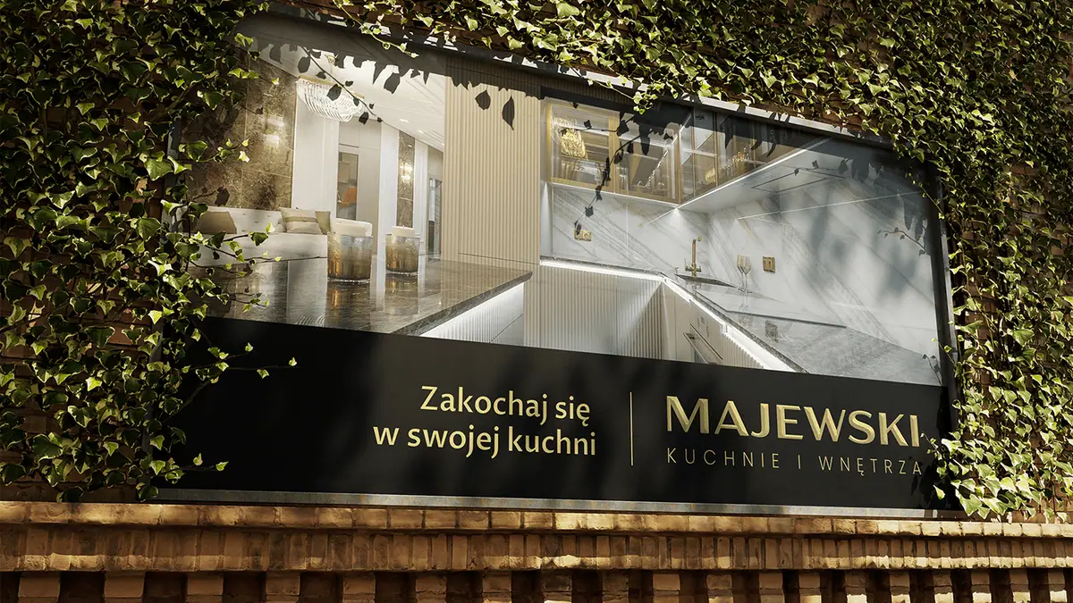 Majewski: baner na ceglanej ścianie z bluszczem, zdjęcie kuchni i hasło Zakochaj się w swojej kuchni