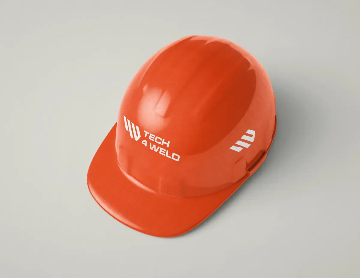 Tech 4 Weld: pomarańczowy kask ochronny z białym logo i sygnetem